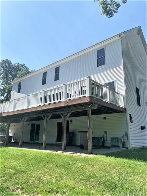 17 Spring Glen Road, Unit A East Lyme, CT 06357 - Photo 5 of 32 a front view of a house with a yard