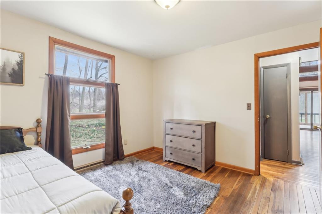 242 Mc Clelland Road Mercer, PA 16137 - Photo 11 of 26 a bedroom with a bed and a window