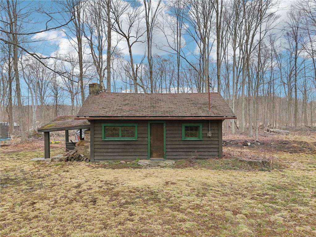 242 Mc Clelland Road Mercer, PA 16137 - Photo 24 of 26 a house view with a wooden fencing
