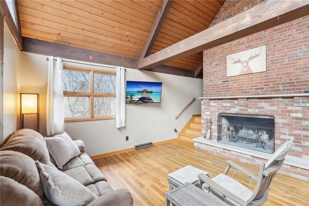 242 Mc Clelland Road Mercer, PA 16137 - Photo 4 of 26 a bed room with a bed and a fireplace