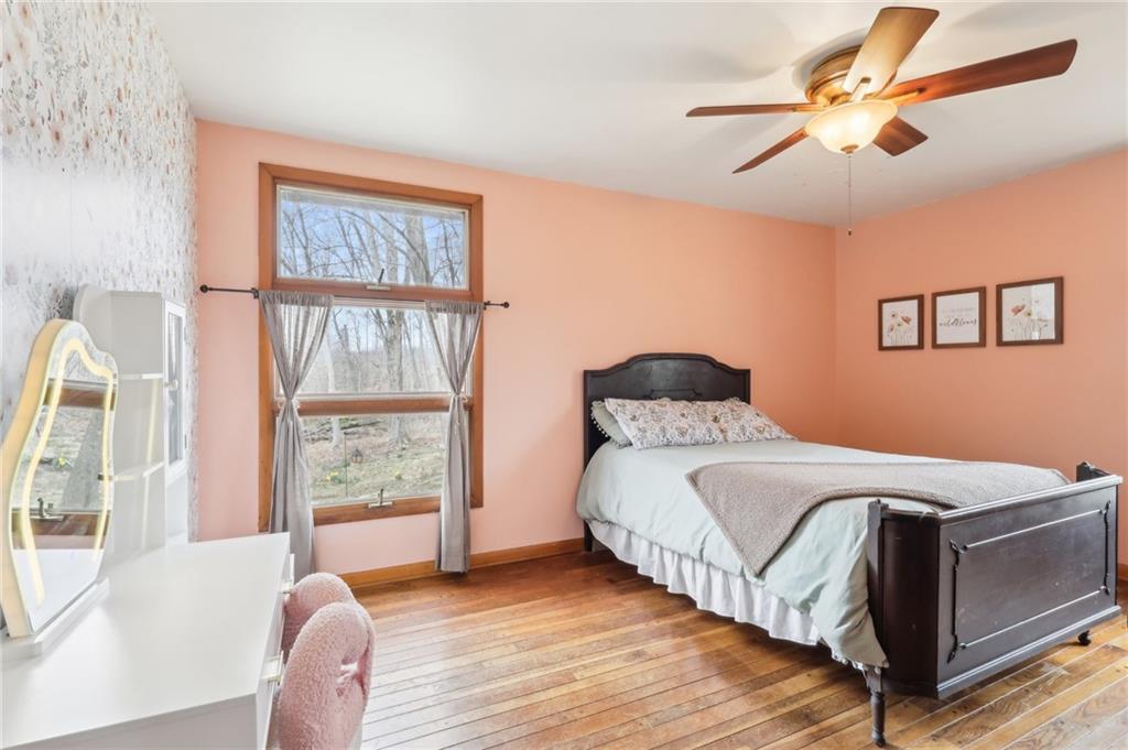 242 Mc Clelland Road Mercer, PA 16137 - Photo 10 of 26 a bedroom with a bed and a large window