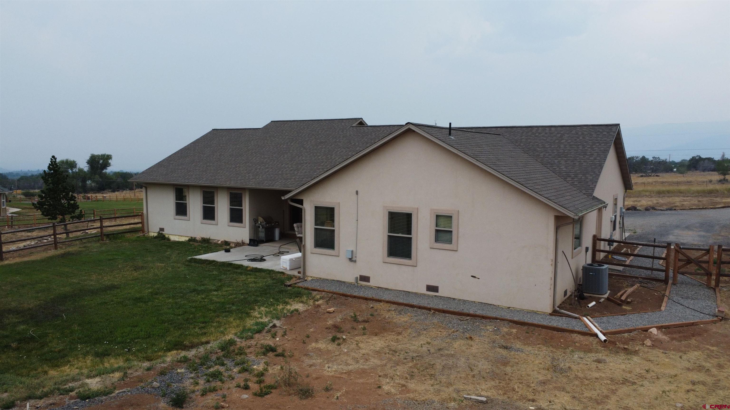 18200 Surface Creek Road Cedaredge, CO 81413 - Photo 11 of 39 a house view with a backyard space
