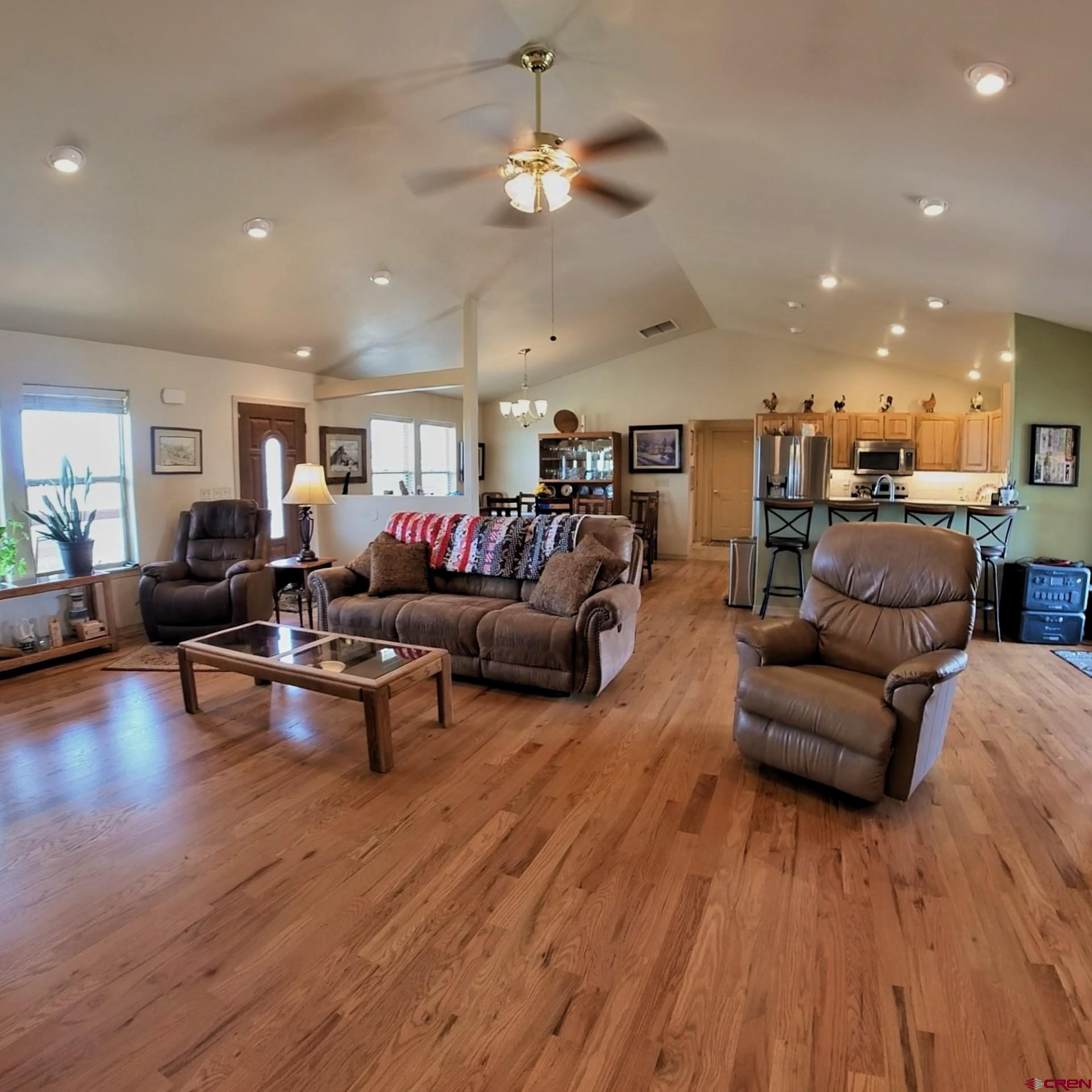 18200 Surface Creek Road Cedaredge, CO 81413 - Photo 15 of 39 a living room with furniture and a wooden floor