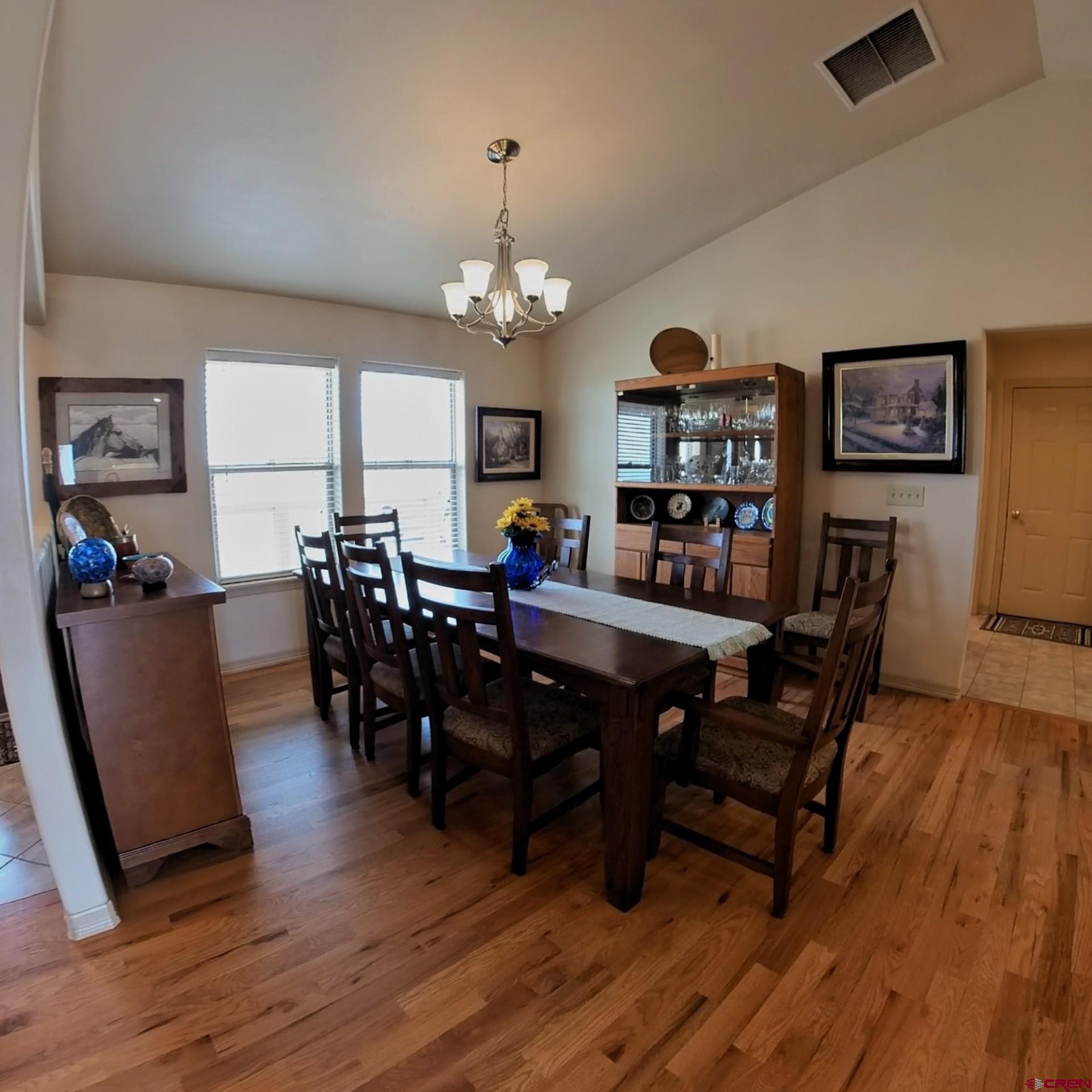 18200 Surface Creek Road Cedaredge, CO 81413 - Photo 17 of 39 a view of a dining room with furniture and wooden floor