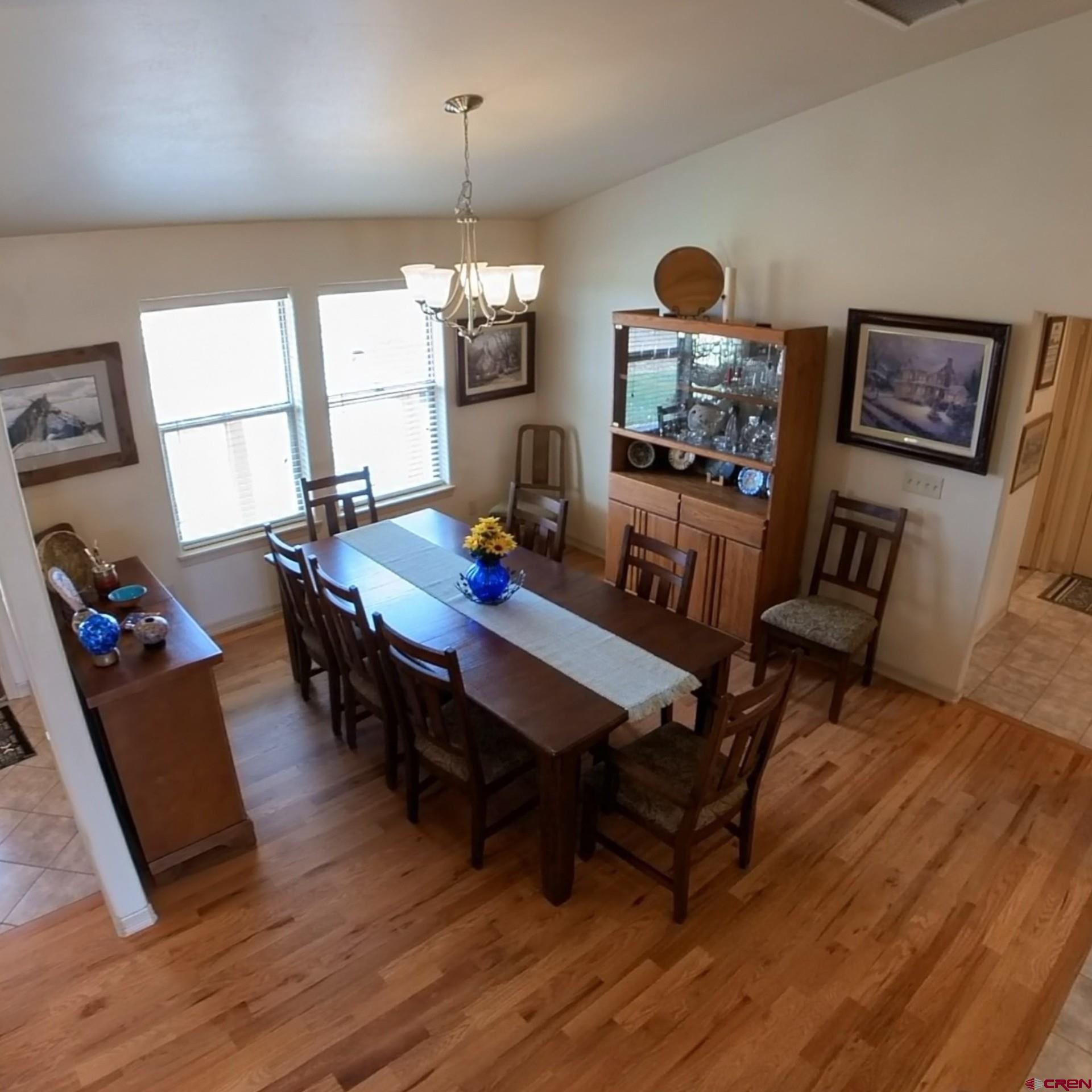 18200 Surface Creek Road Cedaredge, CO 81413 - Photo 23 of 39 a view of a dining room with furniture and wooden floor