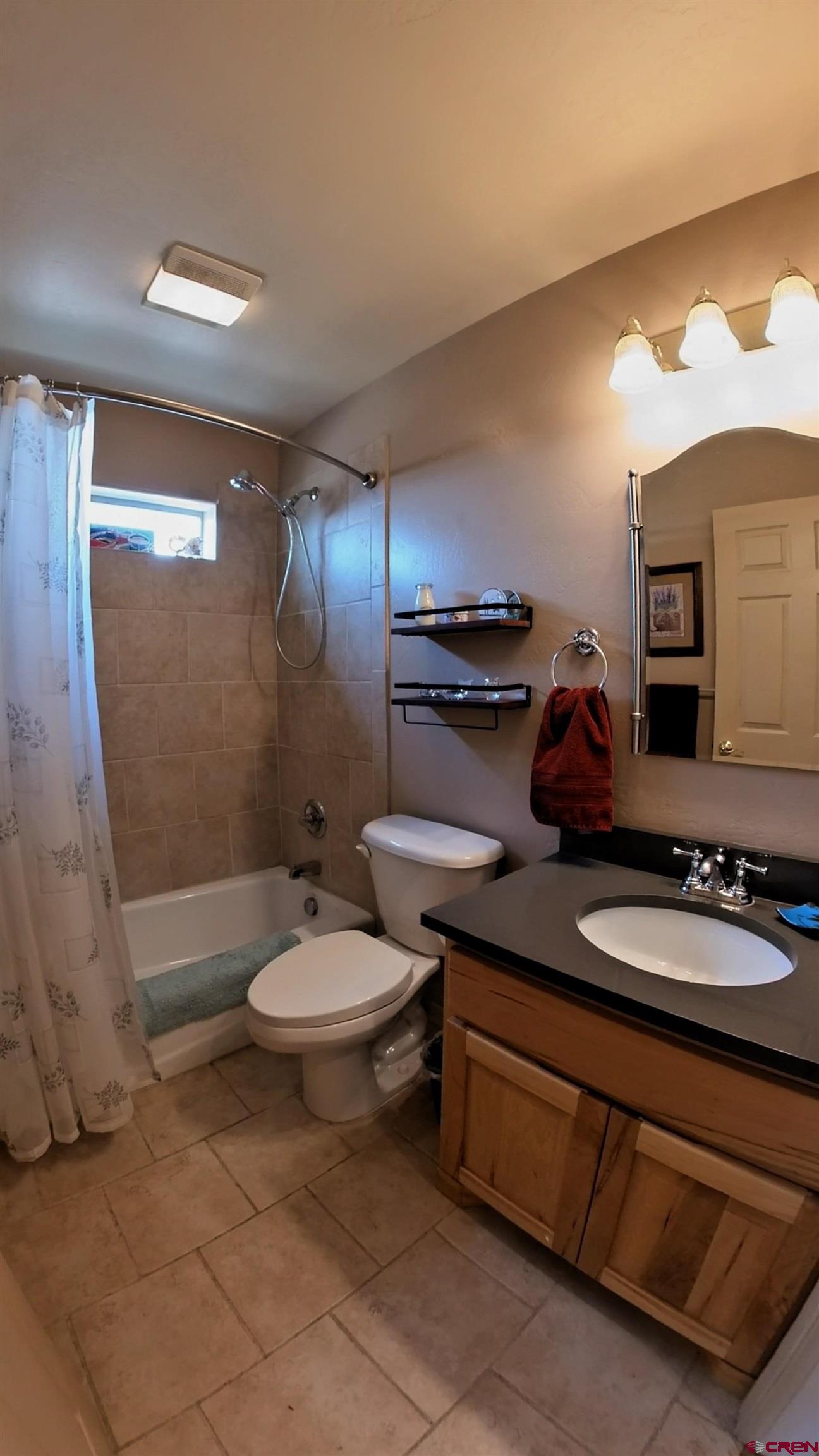 18200 Surface Creek Road Cedaredge, CO 81413 - Photo 23 of 39 a bathroom with a double vanity sink toilet and a mirror