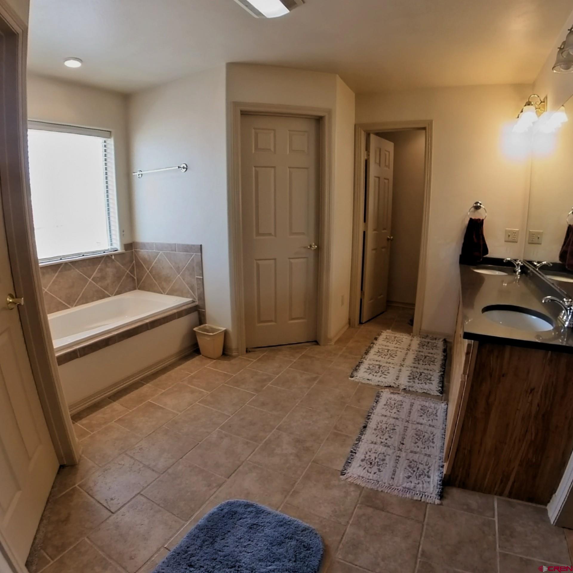 18200 Surface Creek Road Cedaredge, CO 81413 - Photo 26 of 39 a living room with furniture and a flat screen tv