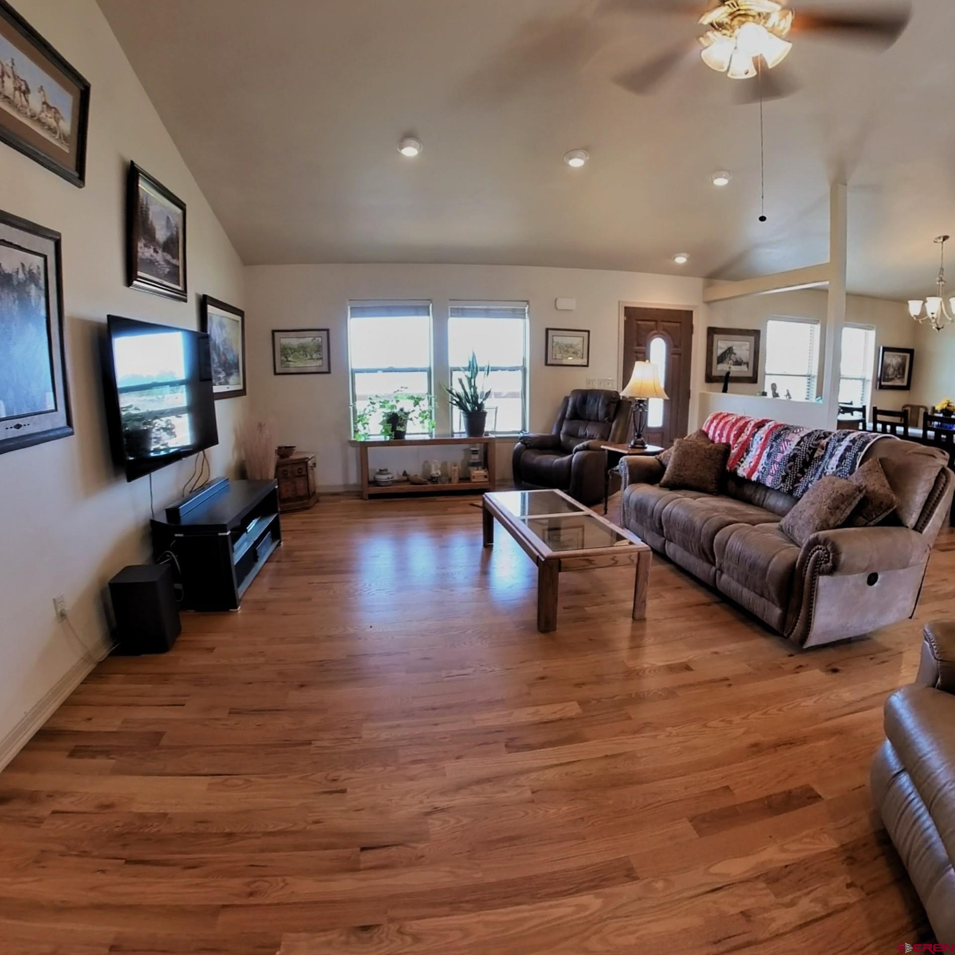 18200 Surface Creek Road Cedaredge, CO 81413 - Photo 38 of 39 a living room with furniture and a flat screen tv