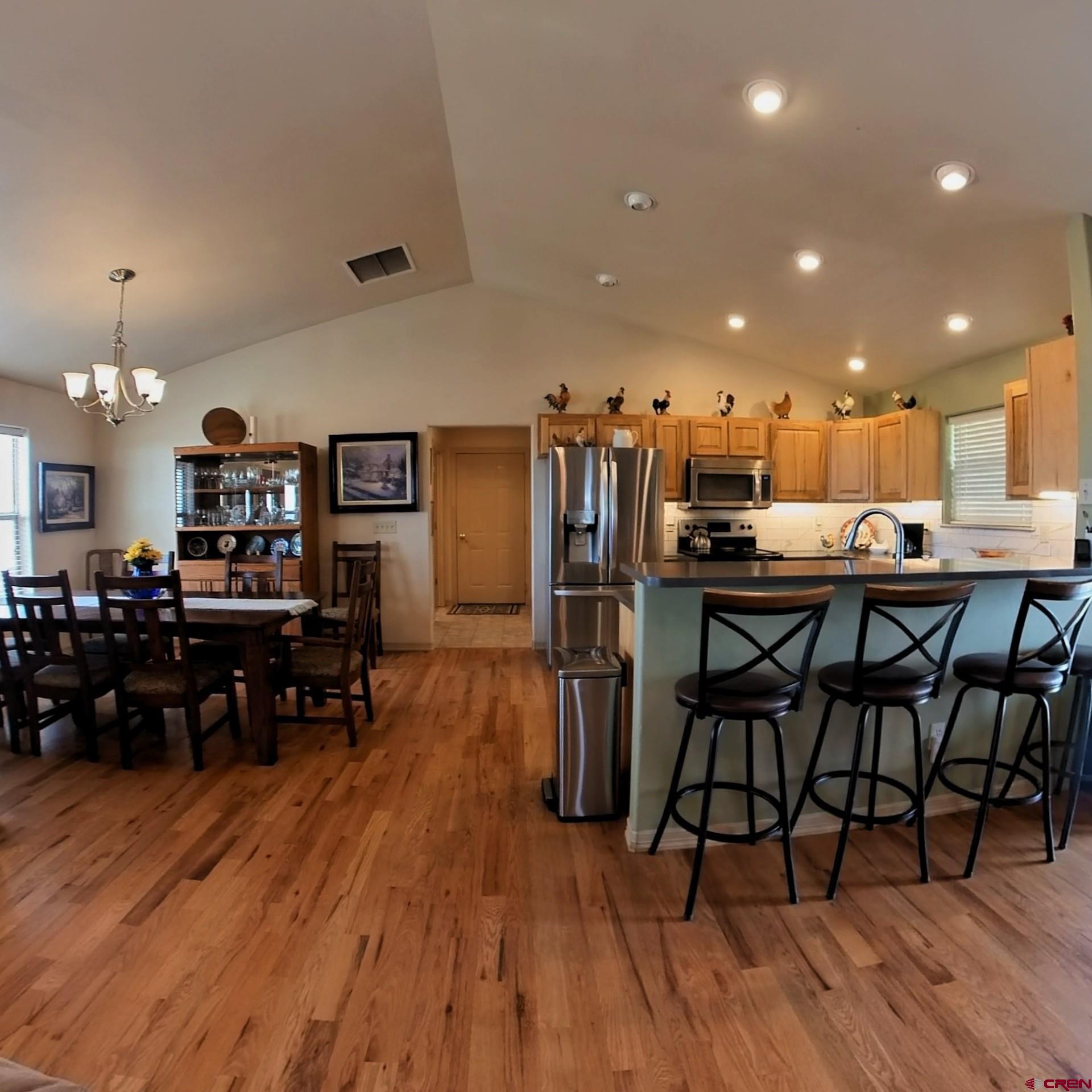 18200 Surface Creek Road Cedaredge, CO 81413 - Photo 38 of 39 a view of a dining room with furniture and wooden floor