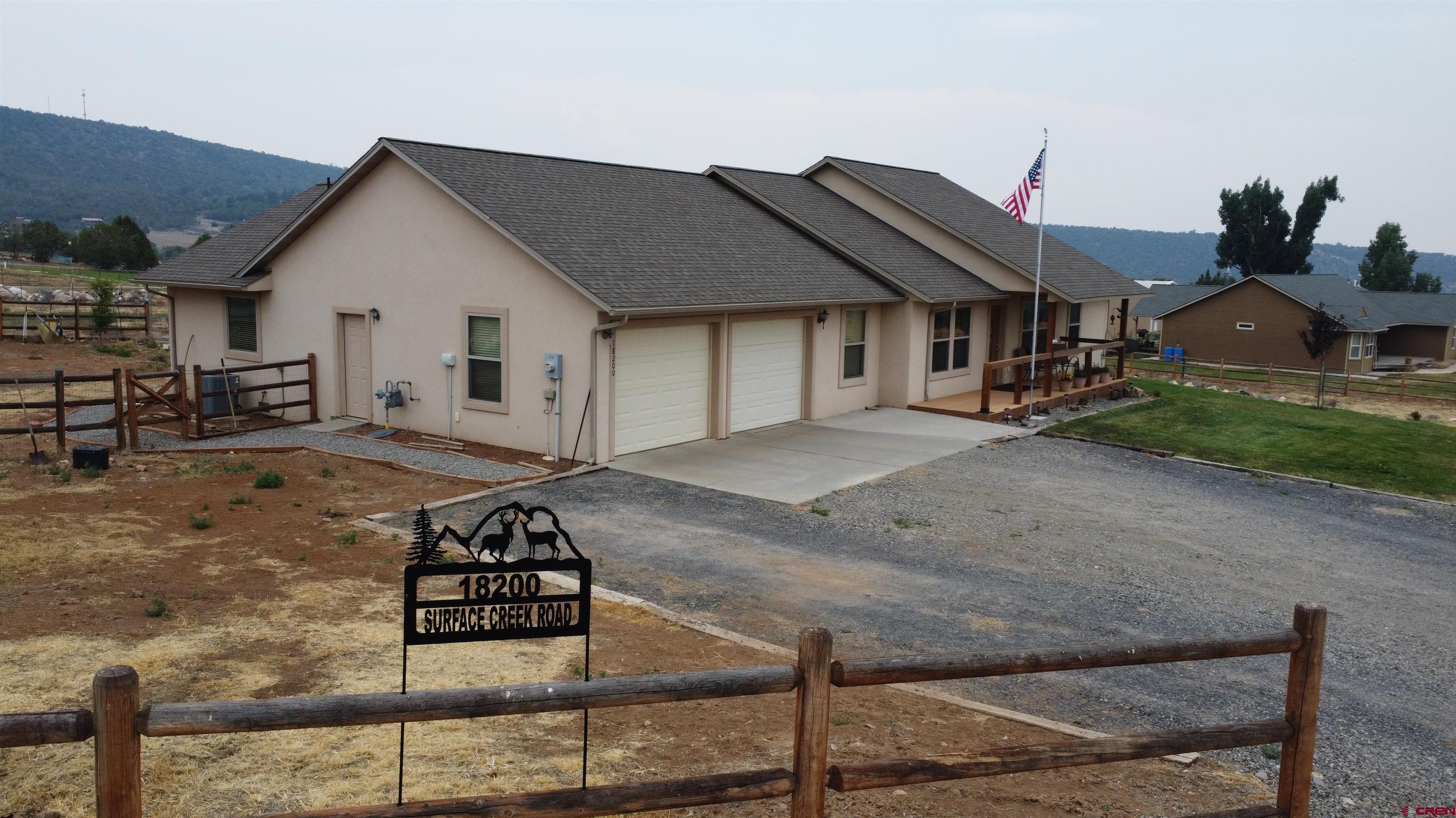 18200 Surface Creek Road Cedaredge, CO 81413 - Photo 39 of 39 a view of a house with backyard