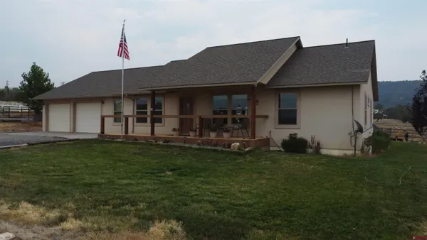 a house view with a backyard space