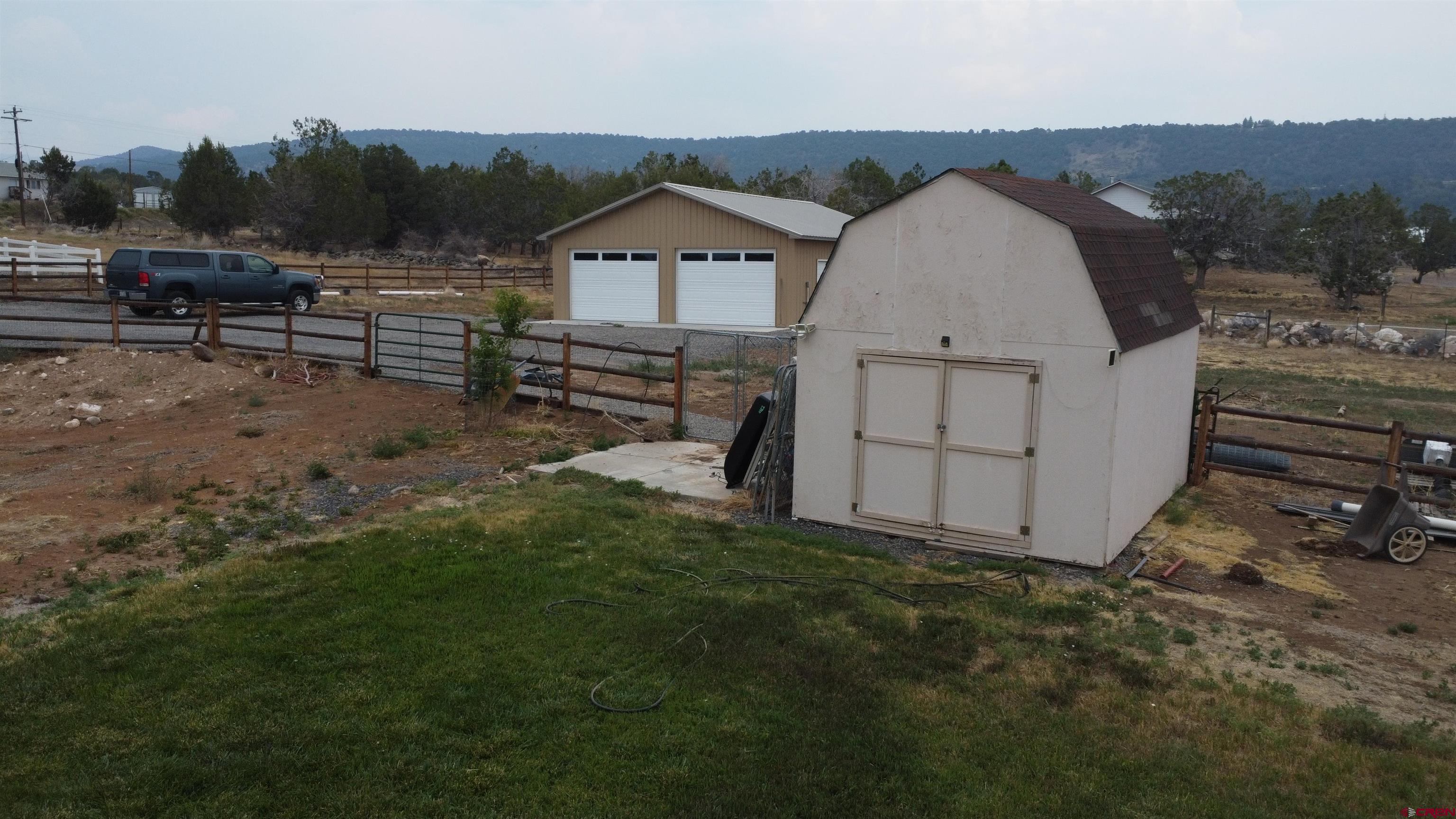 18200 Surface Creek Road Cedaredge, CO 81413 - Photo 6 of 39 an aerial view of a house with garden