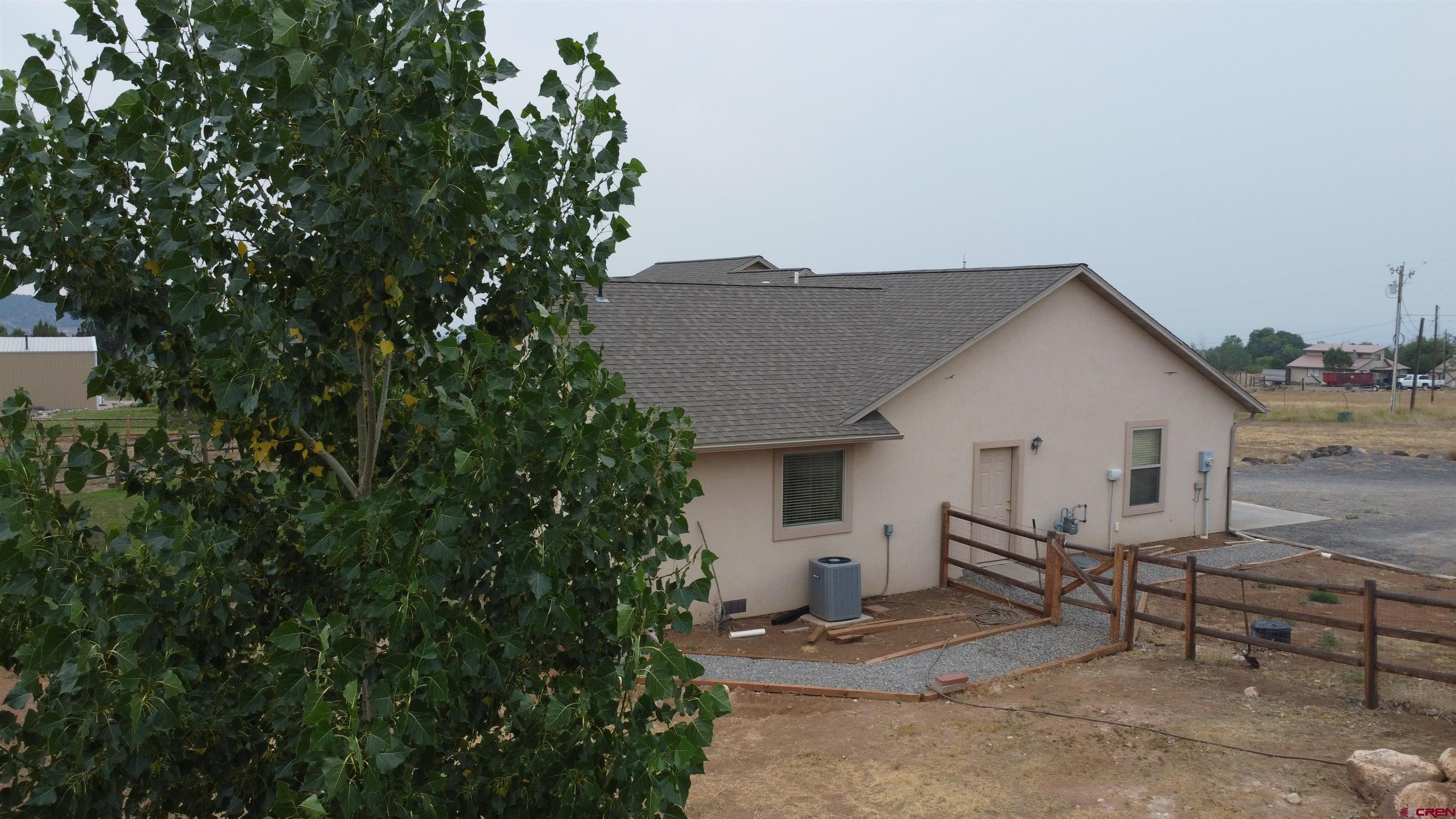 18200 Surface Creek Road Cedaredge, CO 81413 - Photo 10 of 39 a view of a house with backyard and sitting area