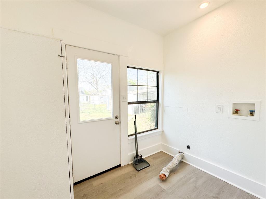 904 West 7th Street Cisco, TX 76437 - Photo 19 of 37 a room with gym equipment and large window