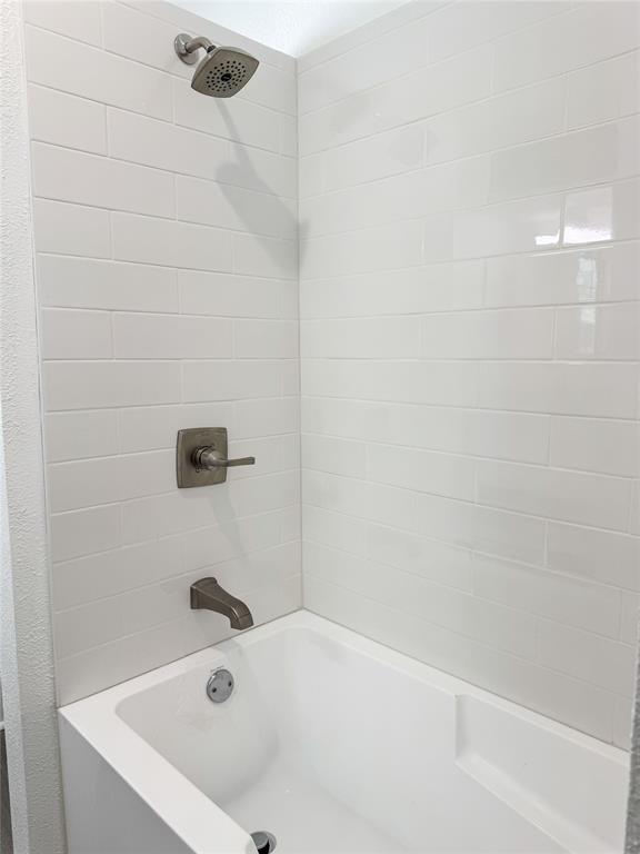904 West 7th Street Cisco, TX 76437 - Photo 25 of 37 a bathroom with a tub