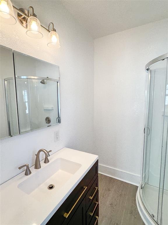 904 West 7th Street Cisco, TX 76437 - Photo 34 of 37 a bathroom with a sink and a mirror