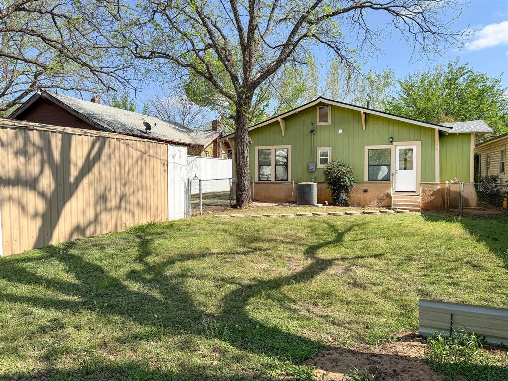 904 West 7th Street Cisco, TX 76437 - Photo 35 of 37 a view of a house with a yard