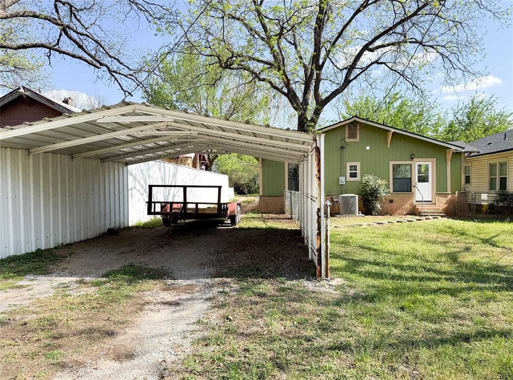 904 West 7th Street Cisco, TX 76437 - Photo 36 of 37 a view of a house with a yard