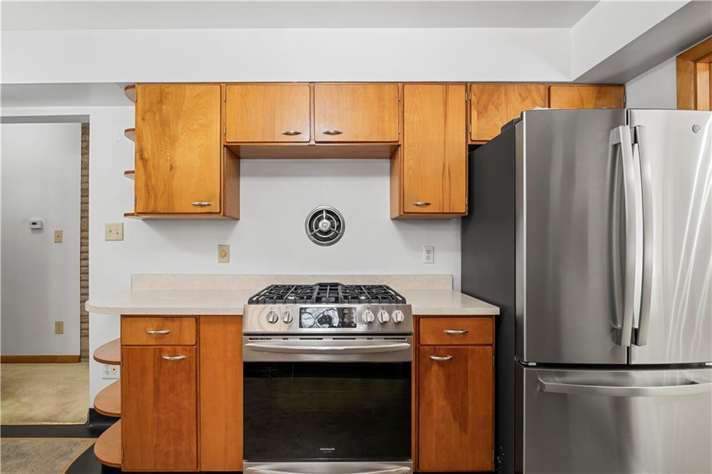 340 Carley Avenue Sharon, PA 16146 - Photo 13 of 28 a kitchen with stainless steel appliances granite countertop a refrigerator and a stove