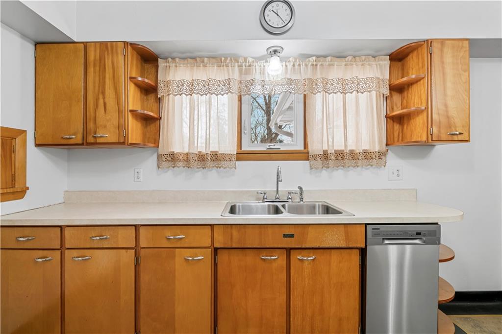340 Carley Avenue Sharon, PA 16146 - Photo 14 of 28 a kitchen with stainless steel appliances wooden cabinets a sink and a window