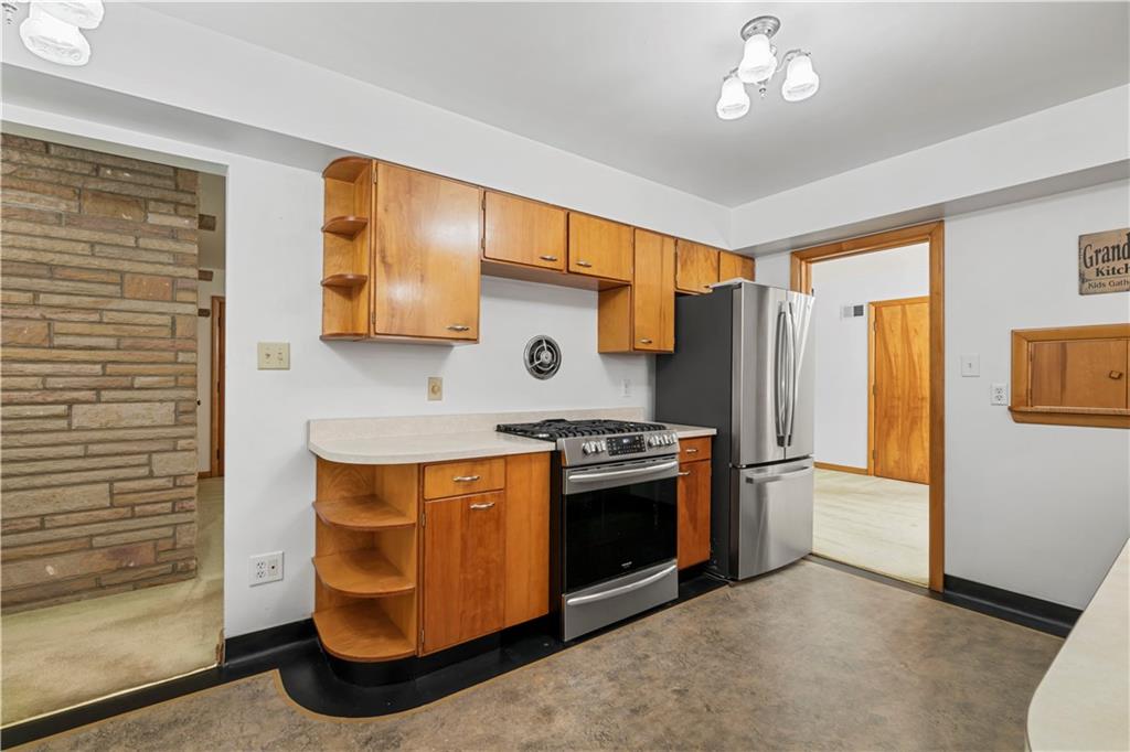 340 Carley Avenue Sharon, PA 16146 - Photo 15 of 28 a kitchen with stainless steel appliances granite countertop a stove a refrigerator and a refrigerator