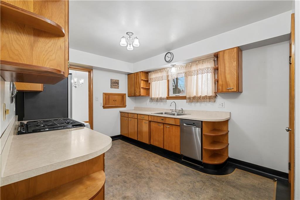 340 Carley Avenue Sharon, PA 16146 - Photo 16 of 28 a kitchen with stainless steel appliances granite countertop a sink and a stove