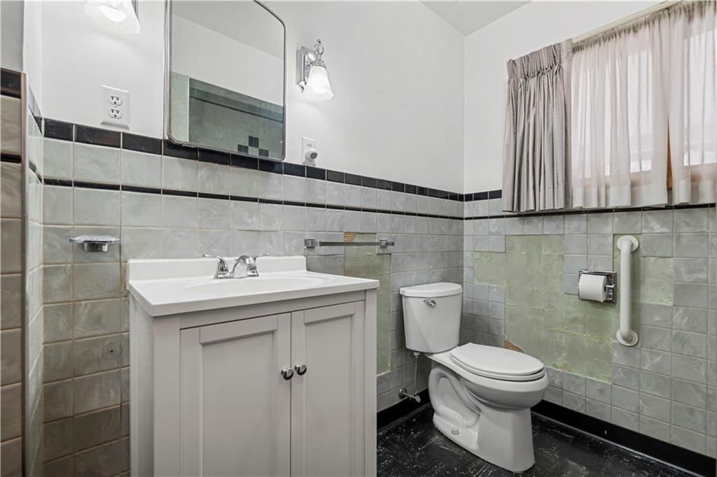 340 Carley Avenue Sharon, PA 16146 - Photo 17 of 28 a bathroom with a sink a toilet and mirror