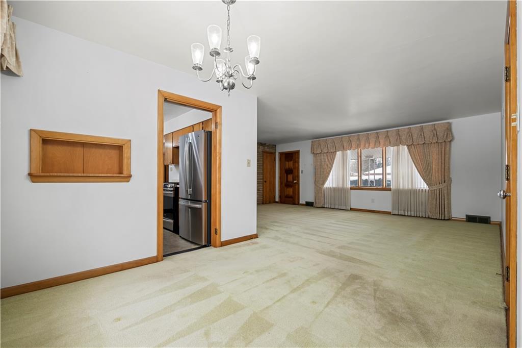 340 Carley Avenue Sharon, PA 16146 - Photo 10 of 28 a view of empty room with a fireplace and window