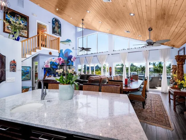 a balcony with wooden floor and lake view
