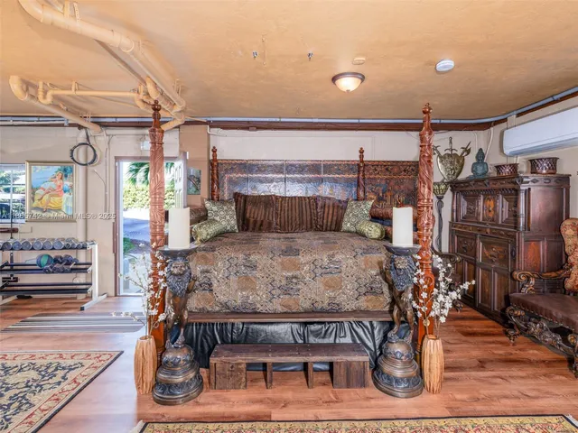 a living room with furniture a flat screen tv and a large window