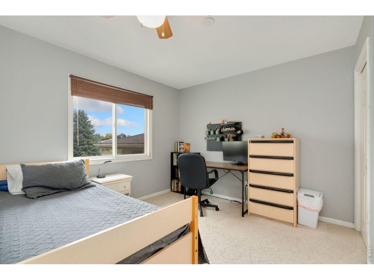1055 Coho Run Fort Collins, CO 80524 - Photo 27 of 43 a bedroom with furniture and a window
