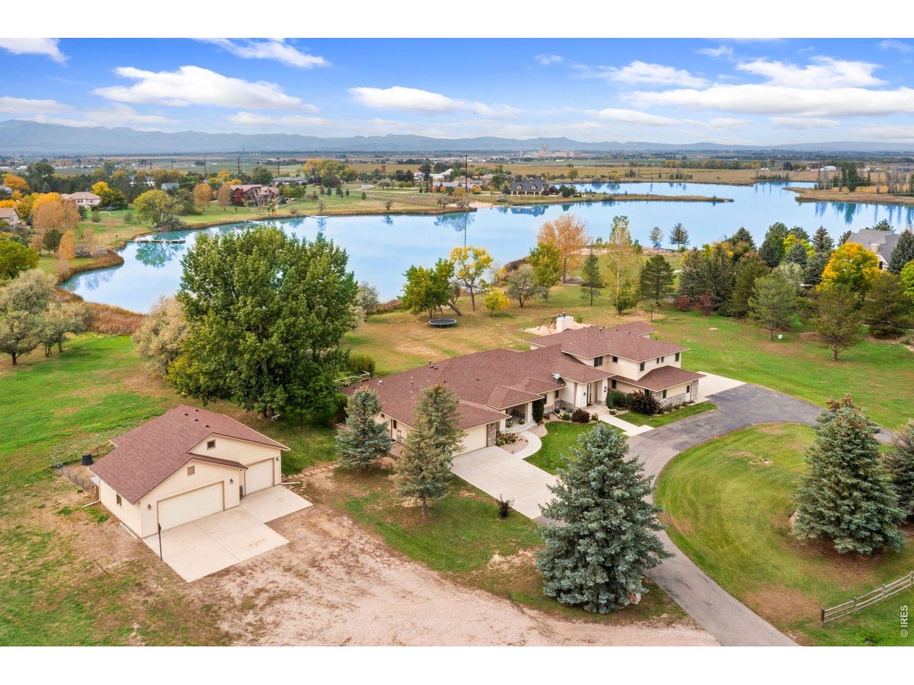 1055 Coho Run Fort Collins, CO 80524 - Photo 3 of 43 an aerial view of a house with a lake view