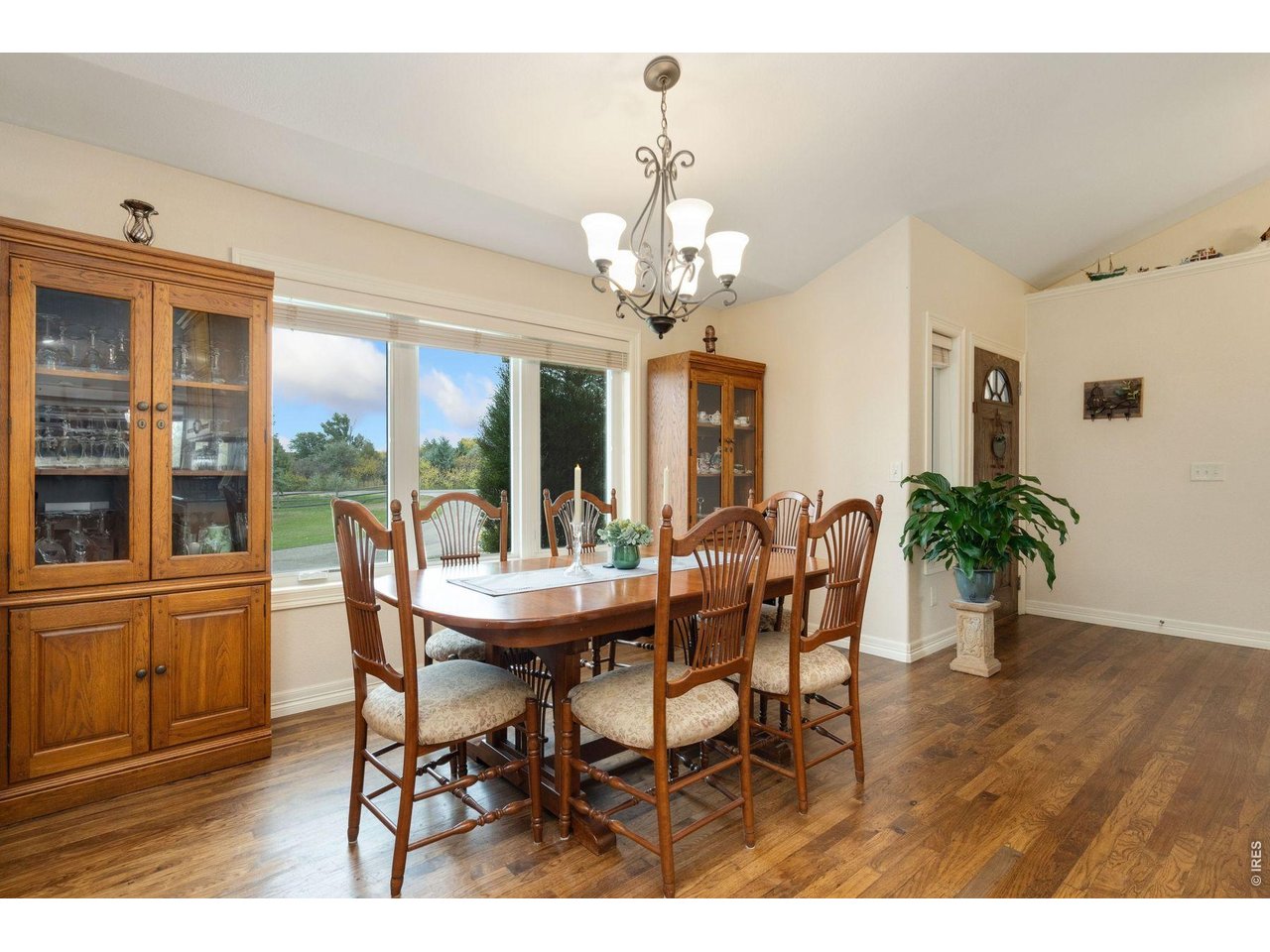 1055 Coho Run Fort Collins, CO 80524 - Photo 9 of 43 a view of a dining room with furniture window and wooden floor