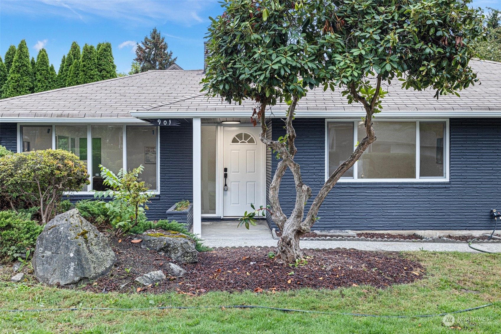 901 Southwest 3rd Place Renton, WA 98057 - Photo 3 of 24 a front view of a house with garden
