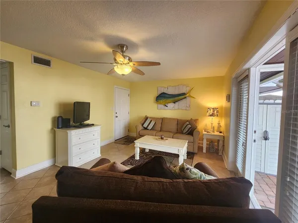 a room with a furniture and flat screen tv
