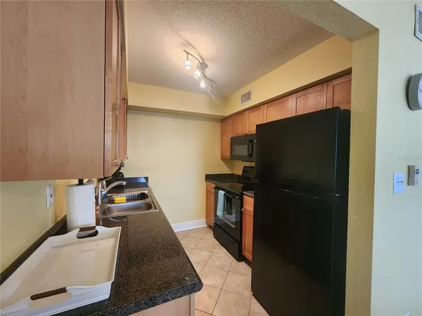 a utility room with stainless steel appliances washer and dryer