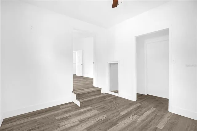 a view of an entryway with wooden floor