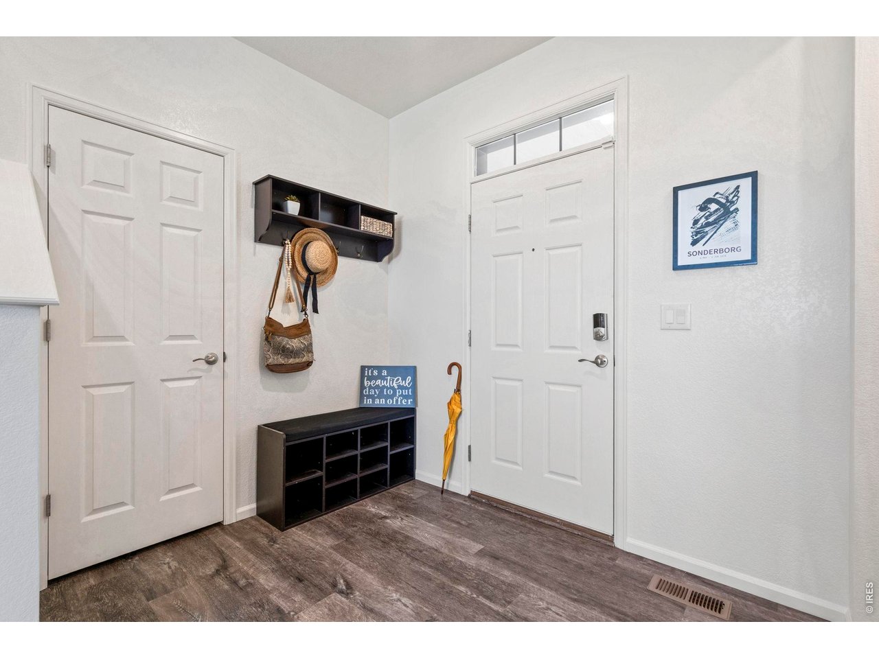 10080 Cedar Street Firestone, CO 80504 - Photo 4 of 38 Front Entrance with two coat closets, built in coat rack and shoe bench included