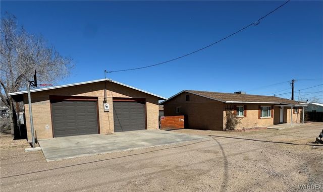 a front view of a house with a garage
