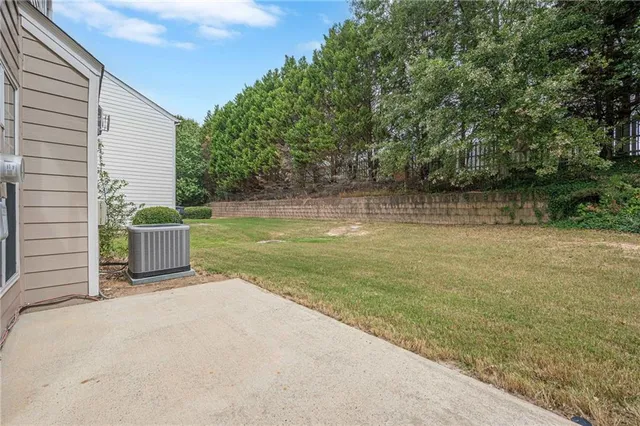 a backyard of a house with lots of green space