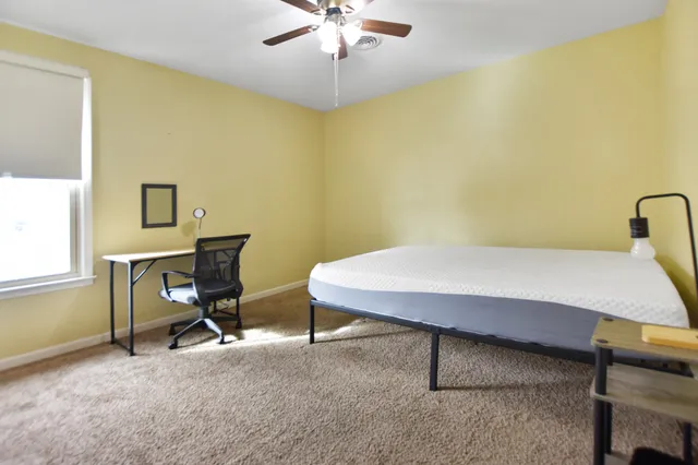 a view of a workspace with furniture