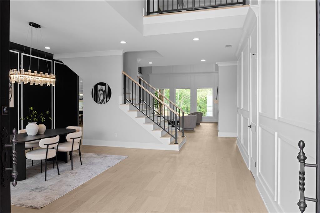 405 Thunder Road Buford, GA 30518 - Photo 11 of 104 a view of an entryway with dining room and stairs