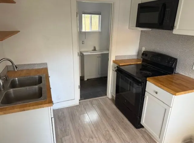 a kitchen with a stove and a microwave