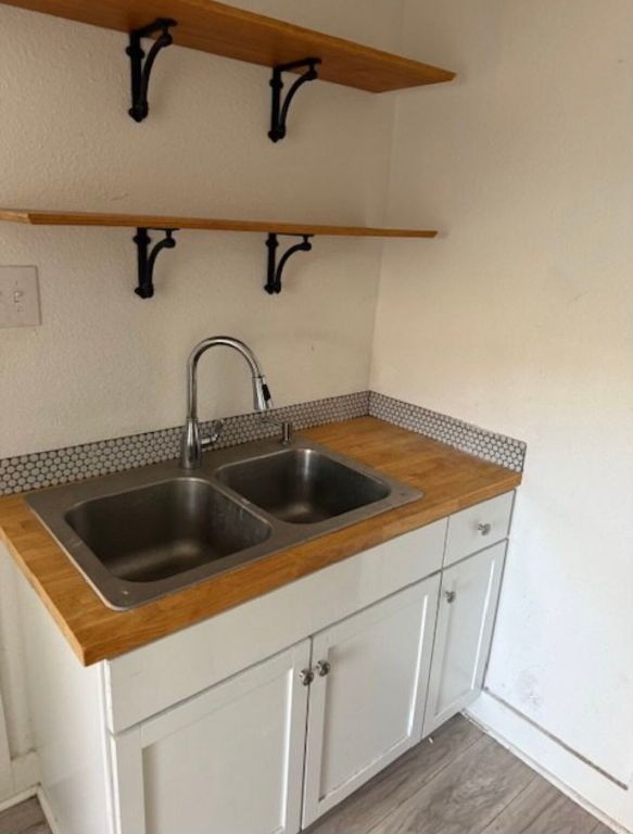 3207 Burleson Road, Unit 1 Austin, TX 78741 - Photo 7 of 11 a close view of a sink a faucet and appliance in the kitchen