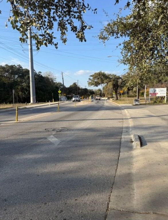 3207 Burleson Road, Unit 1 Austin, TX 78741 - Photo 10 of 11 a yard with road and trees