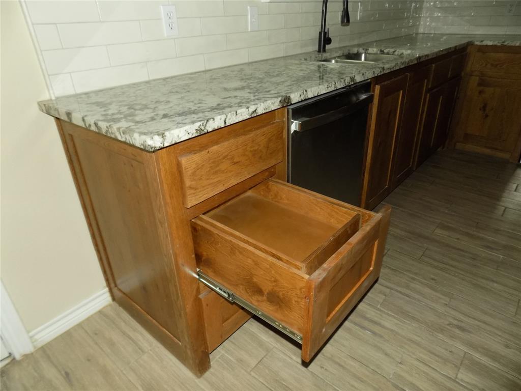 2007 Brown Loop Poolville, TX 76487 - Photo 12 of 32 an outdoor sitting area with wooden floor