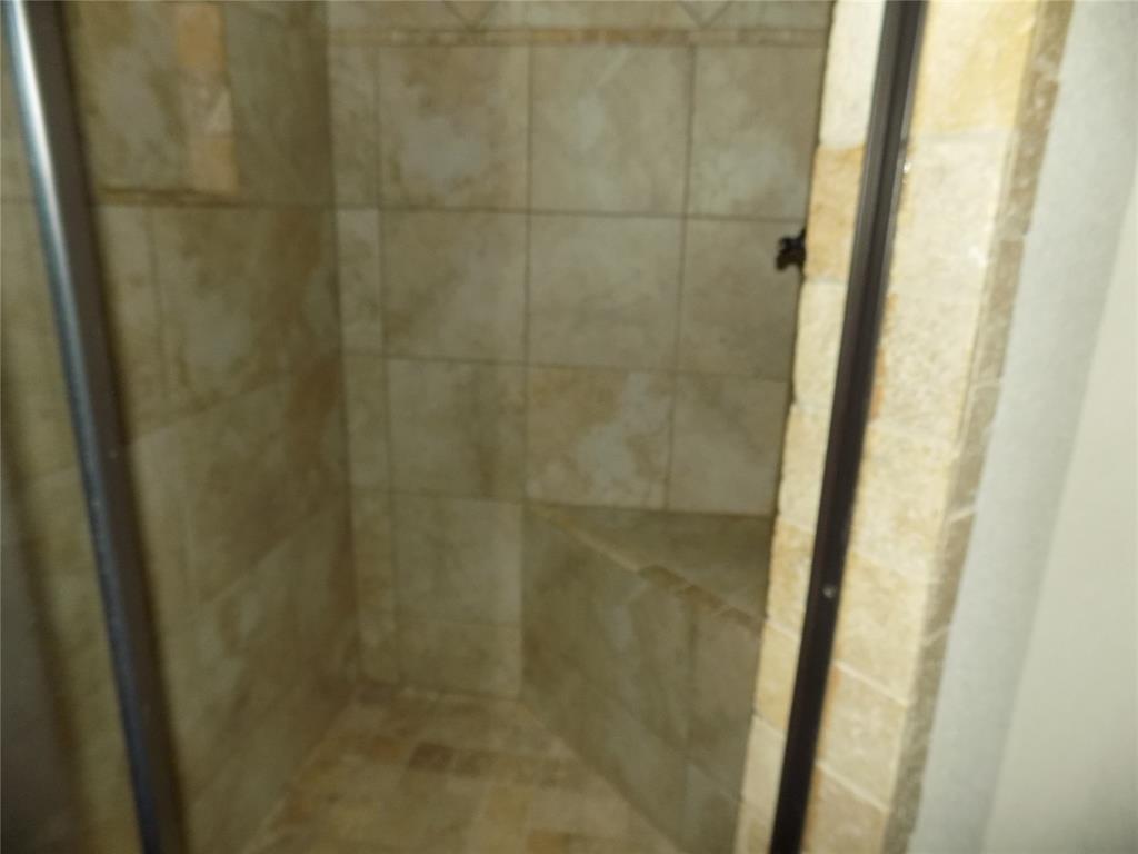2007 Brown Loop Poolville, TX 76487 - Photo 20 of 32 a bathroom with a shower