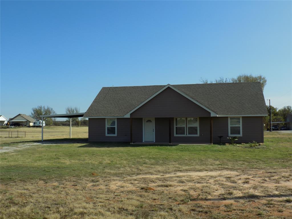 2007 Brown Loop Poolville, TX 76487 - Photo 2 of 32 a front view of a house with a yard
