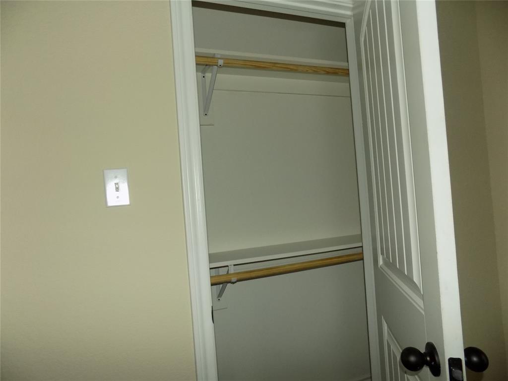 2007 Brown Loop Poolville, TX 76487 - Photo 25 of 32 a bathroom with a glass shower door