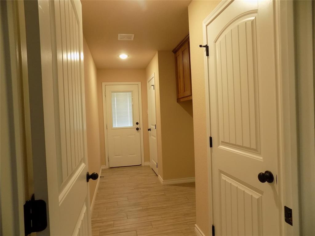 2007 Brown Loop Poolville, TX 76487 - Photo 3 of 32 a bathroom with a shower and a glass door